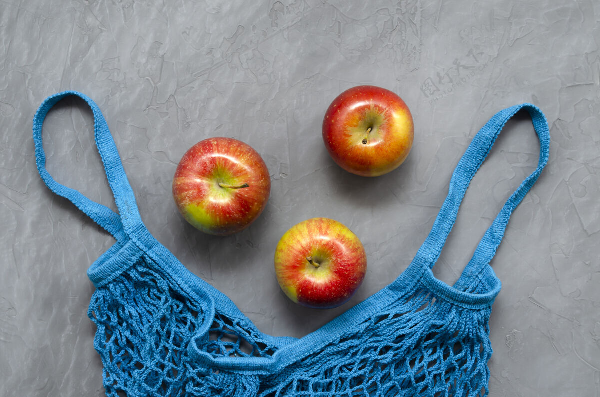 健康蓝色网状环保零废物购物袋与水果红苹果棉花苹果网