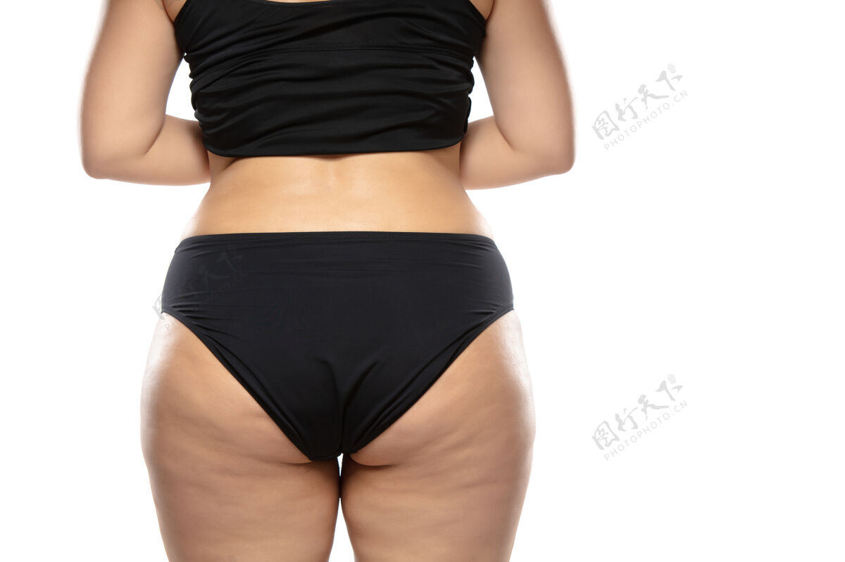 腿部超重的女人腿部和臀部有脂肪团 肥胖的女人身体穿着黑色内衣卫生脂肪团臀部